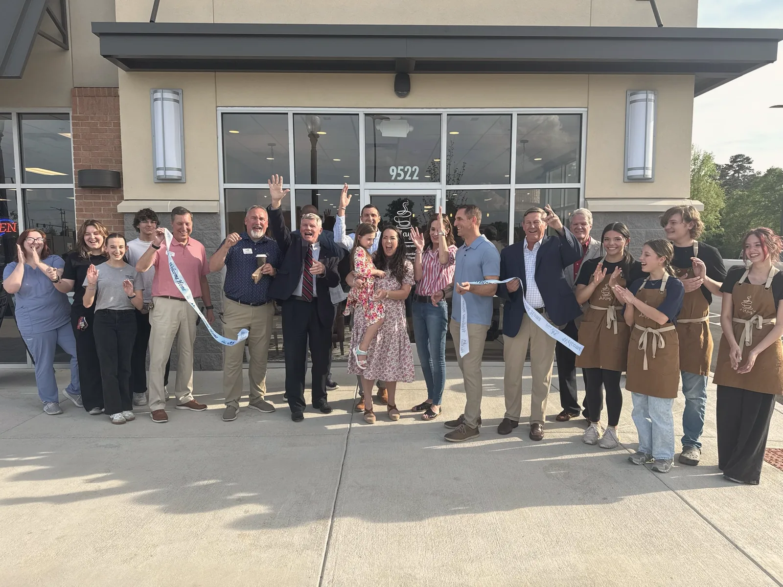 The AKay's Coffee team gathered outside the coffeehouse
